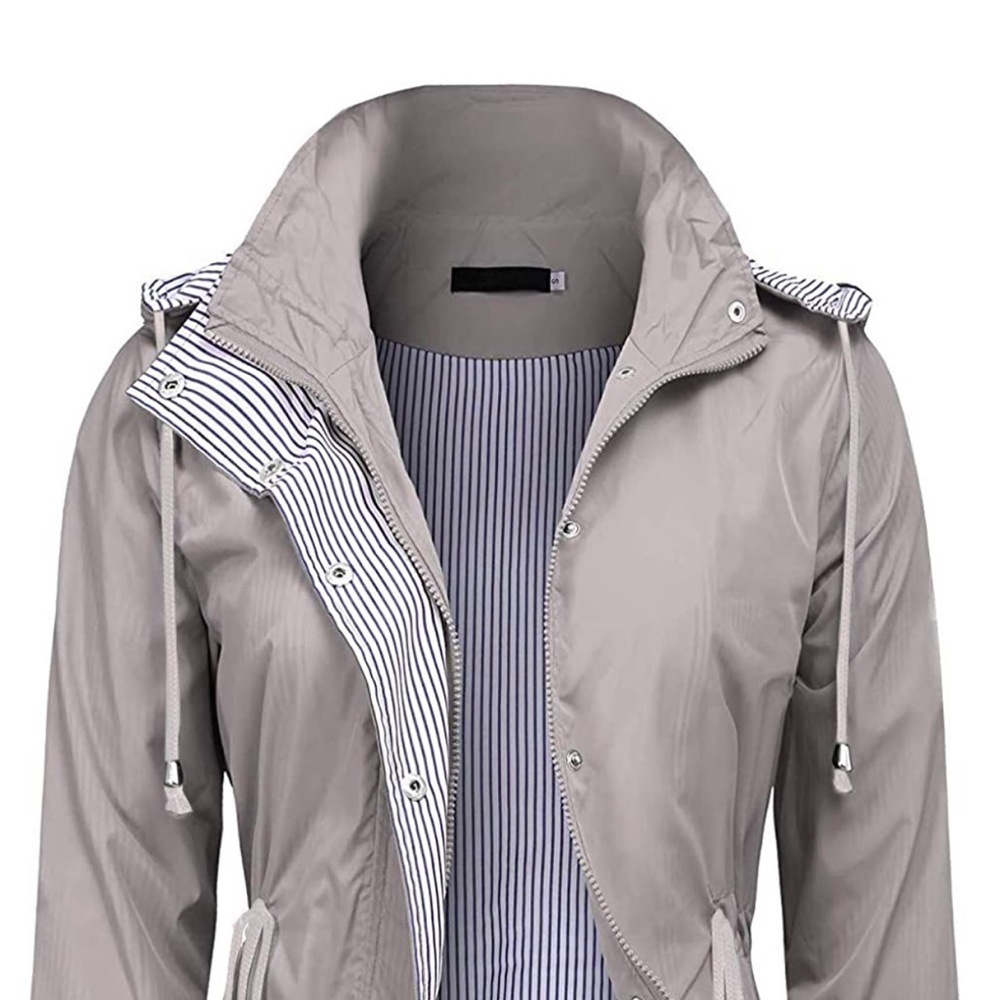 Light grey rain jacket with adjustable draw strings on waist. Size small